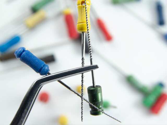 a close up of a metal object with pins and needles